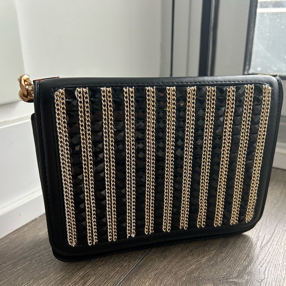 Black and gold faux leather clutch crossbody